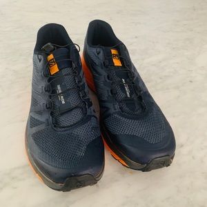 Navy blue and orange running shoe